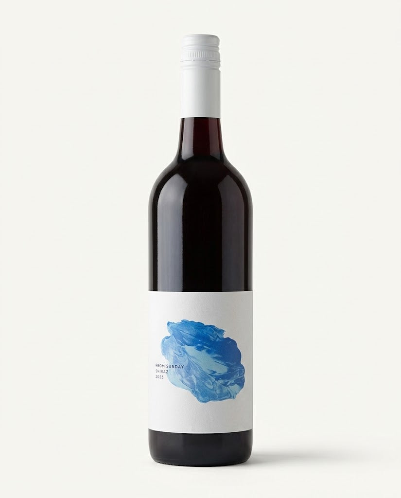 From Sunday Shiraz 2023 bottle, dark glass with white screwcap and white label with a blue paint swirl